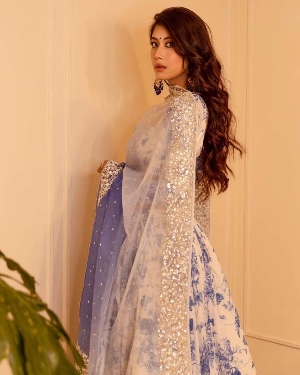 MINDBLOWING FLORAL WHITE LEHENGA CHOLI WITH BLUE FLOWERS