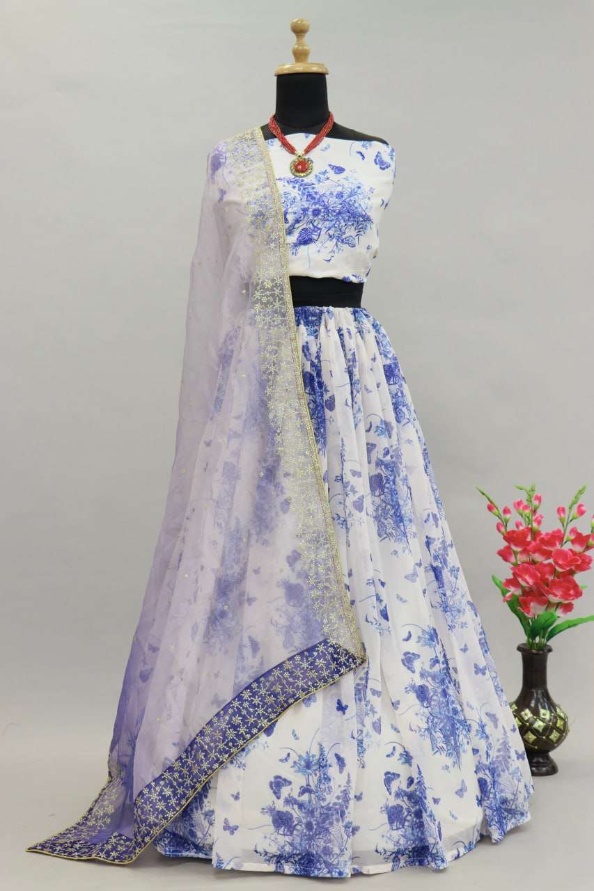 MINDBLOWING FLORAL WHITE LEHENGA CHOLI WITH BLUE FLOWERS