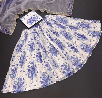 MINDBLOWING FLORAL WHITE LEHENGA CHOLI WITH BLUE FLOWERS